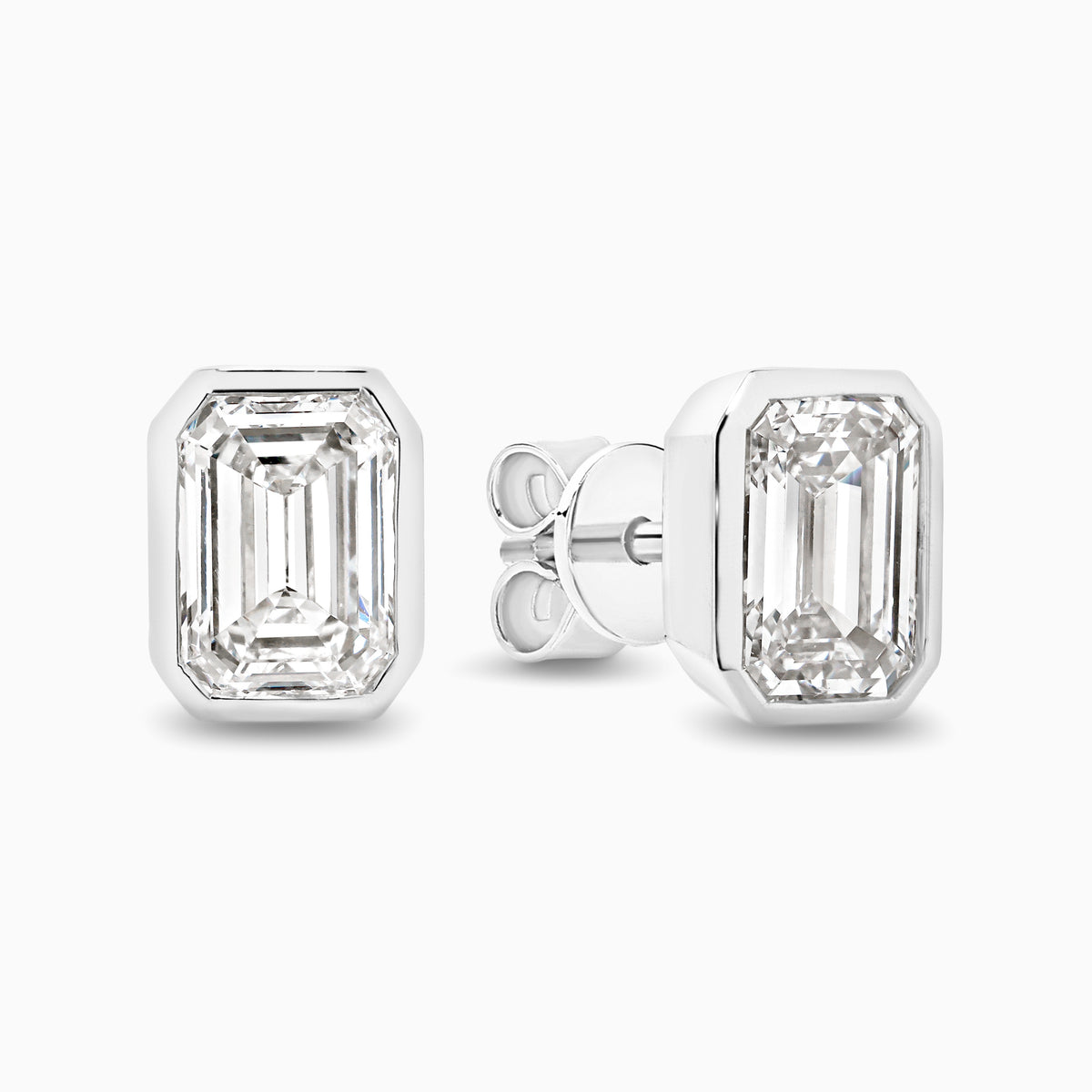 Bezel set 2ct emerald cut lab grown diamond stud earrings in 18ct white gold