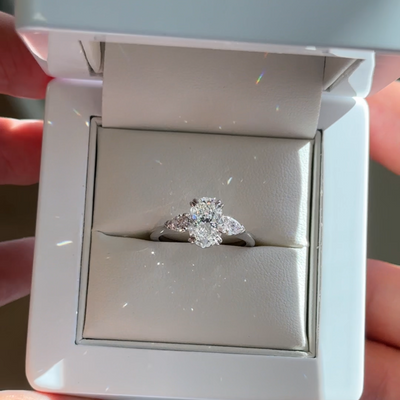 1.81ct oval lab grown diamond engagement ring with pear side stones in platinum