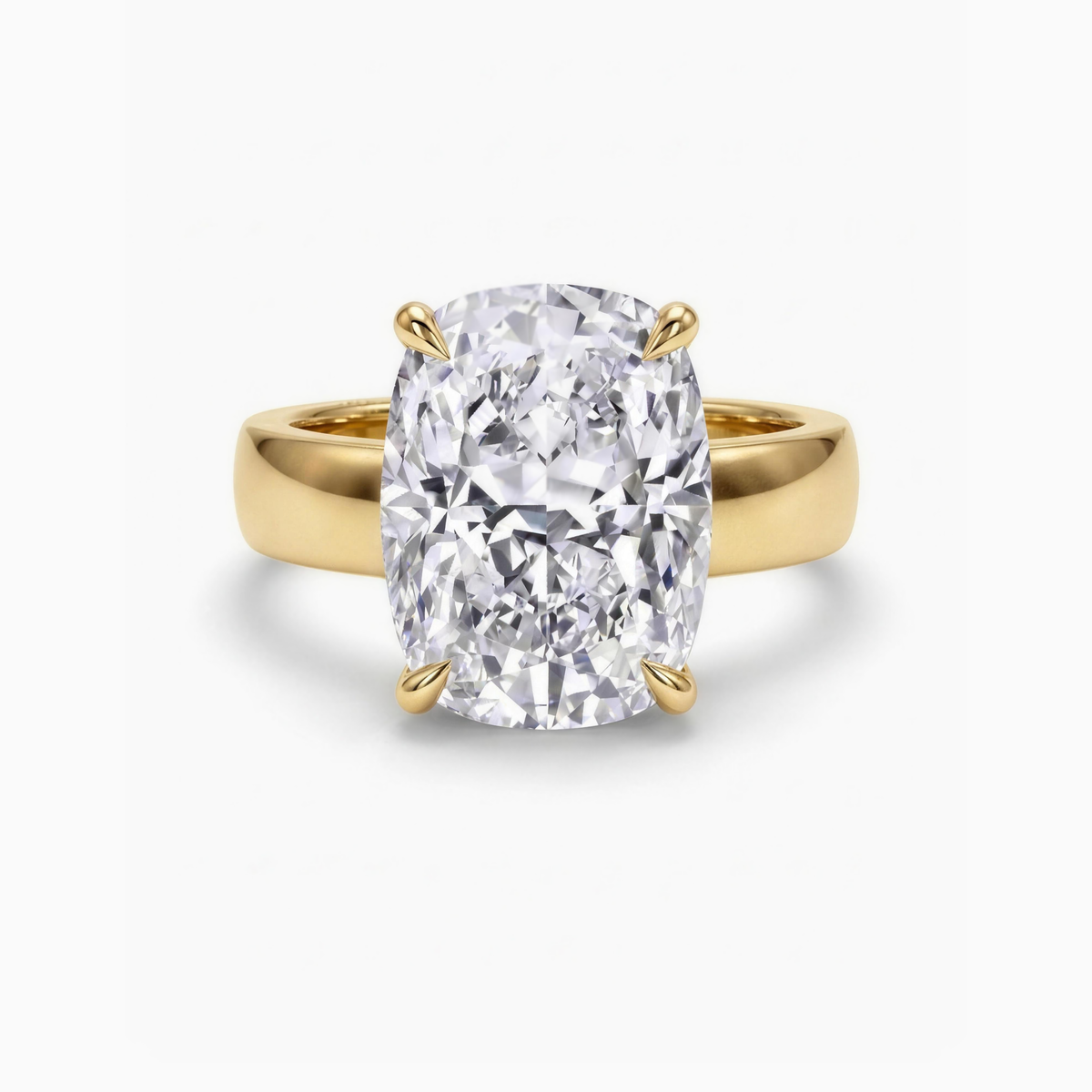 The Maeve cushion solitaire engagement ring in 18ct yellow gold, a 6.00 carat cushion cut lab-grown diamond on a wide 5mm band