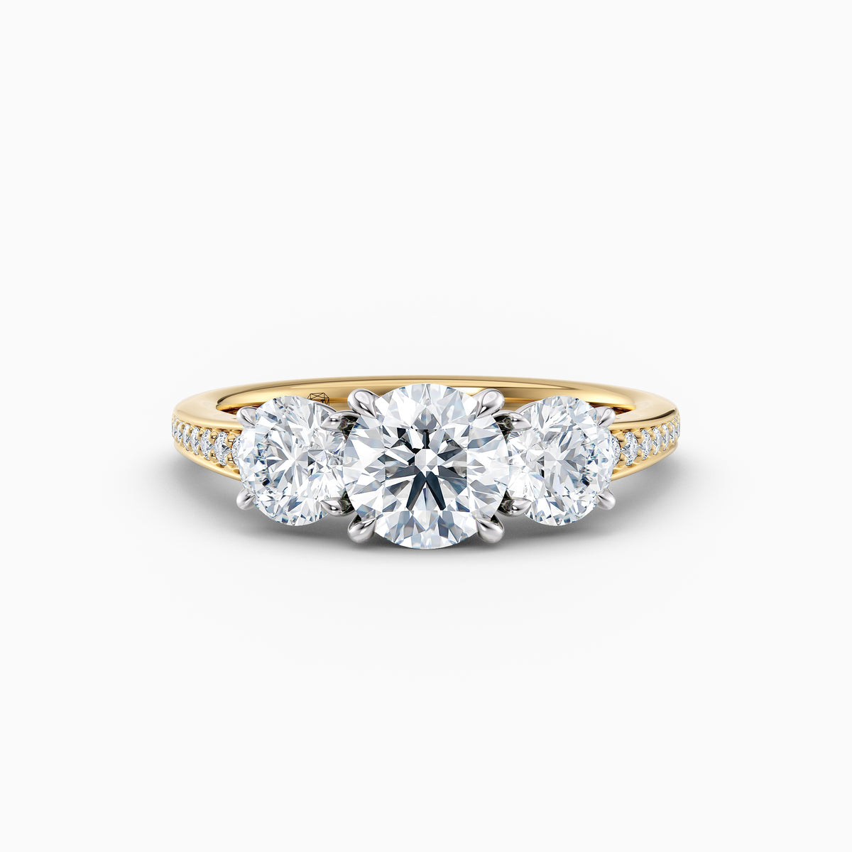 The Adelle round brilliant lab grown diamond three stone engagement ring with pavé band