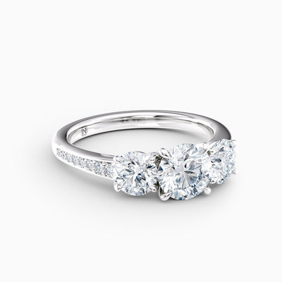 The Adelle round brilliant lab grown diamond three stone engagement ring with pavé band