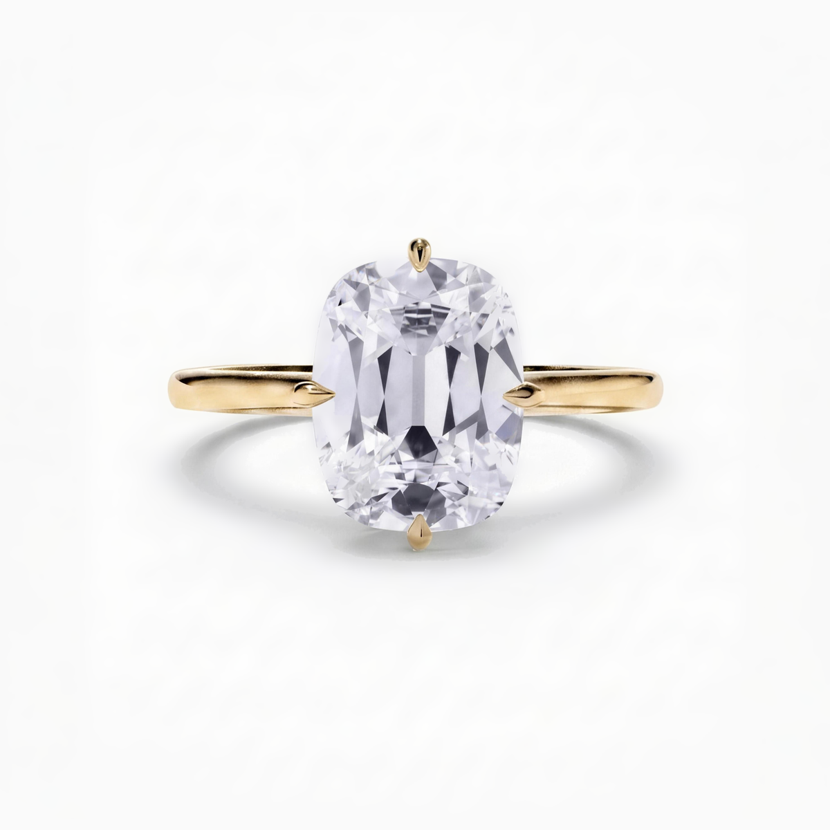 The Eve engagement ring in 18ct yellow gold, a 2.00 carat old mine cushion cut lab-grown diamond solitaire held in compass claws