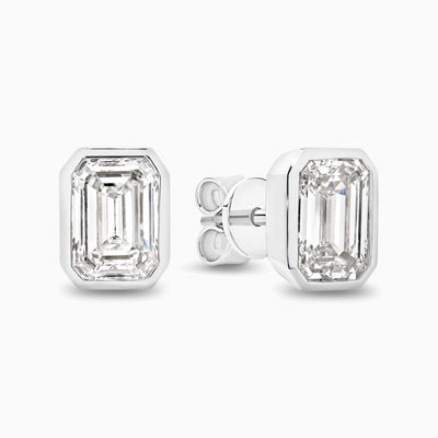 Bezel set 2ct emerald cut lab grown diamond stud earrings in 18ct white gold
