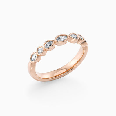 The Rhoda bezel set lab grown diamond wedding band with marquise, pear and round diamonds