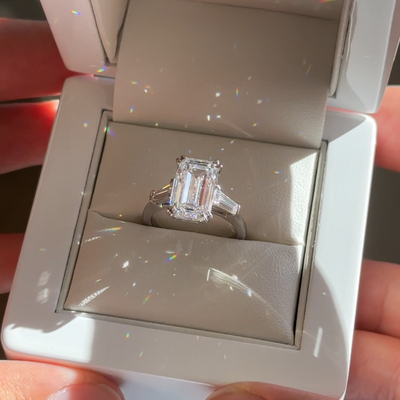 5.16ct emerald cut lab grown diamond three stone engagement ring in platinum, ready to ship