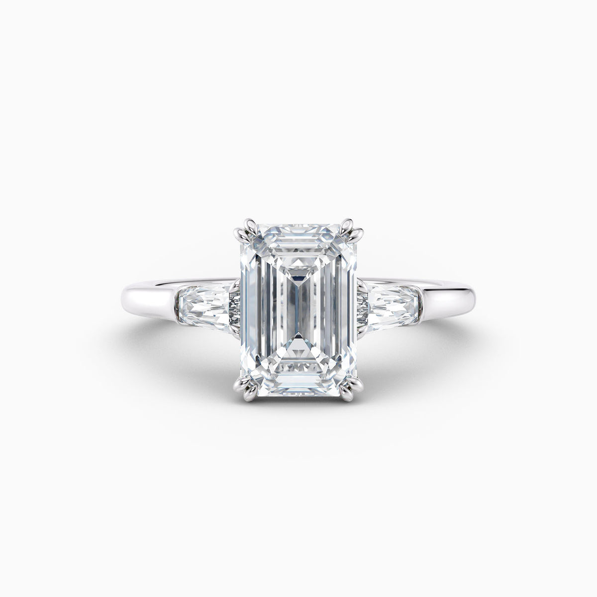 Emerald cut lab grown diamond three stone engagement ring with tapered baguette side stones, hand-crafted in Brisbane