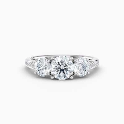 The Adelle round brilliant lab grown diamond three stone engagement ring with pavé band
