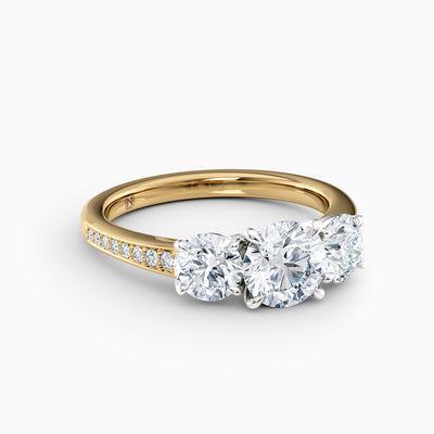 The Adelle round brilliant lab grown diamond three stone engagement ring with pavé band