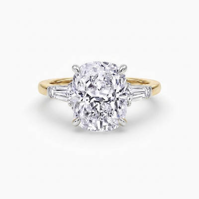 The Francis cushion cut lab grown diamond three stone engagement ring with tapered baguette side stones