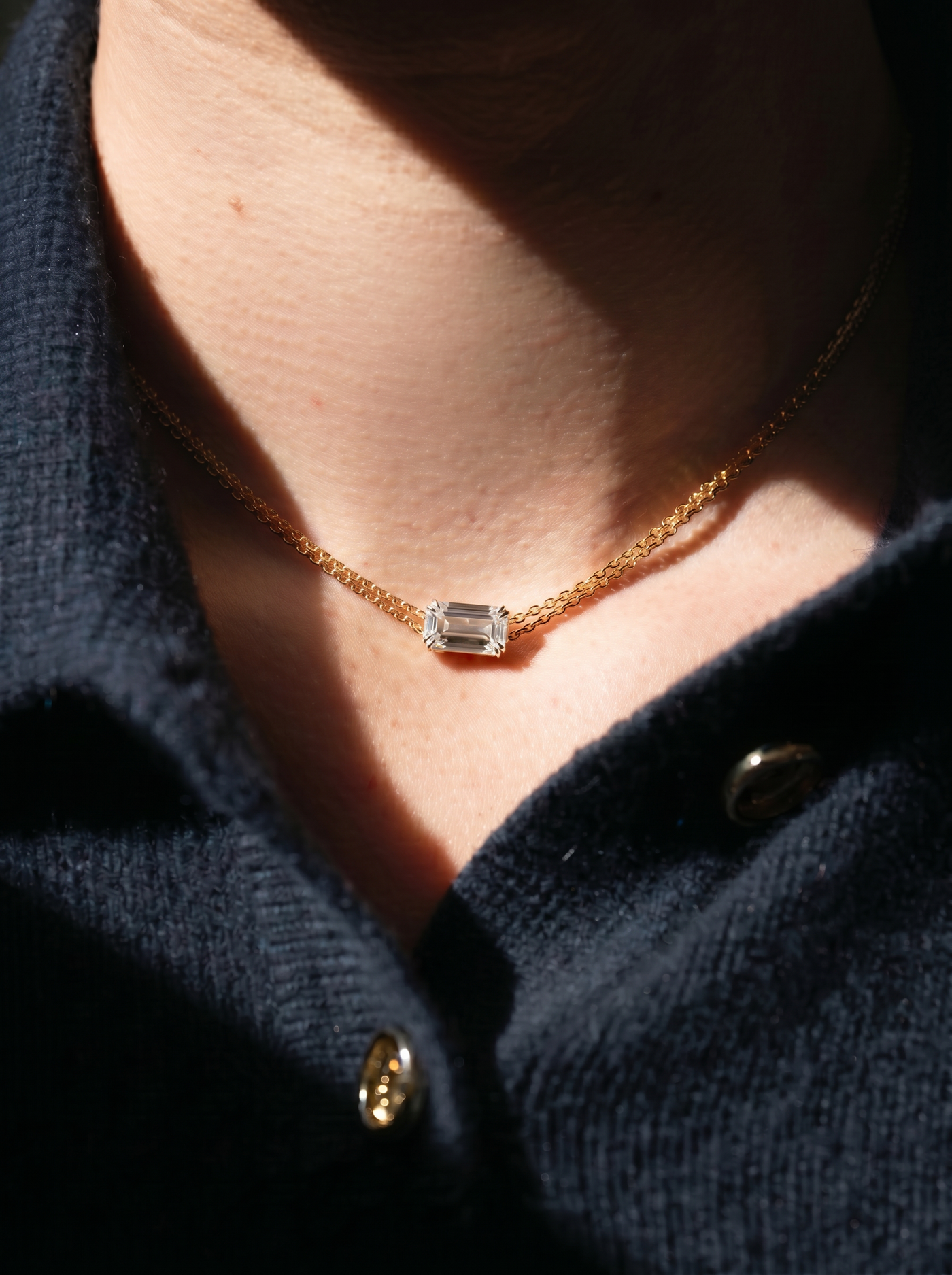 Aurelia, a three carat emerald cut lab-grown diamond pendant set horizontally, from the Evermore collection