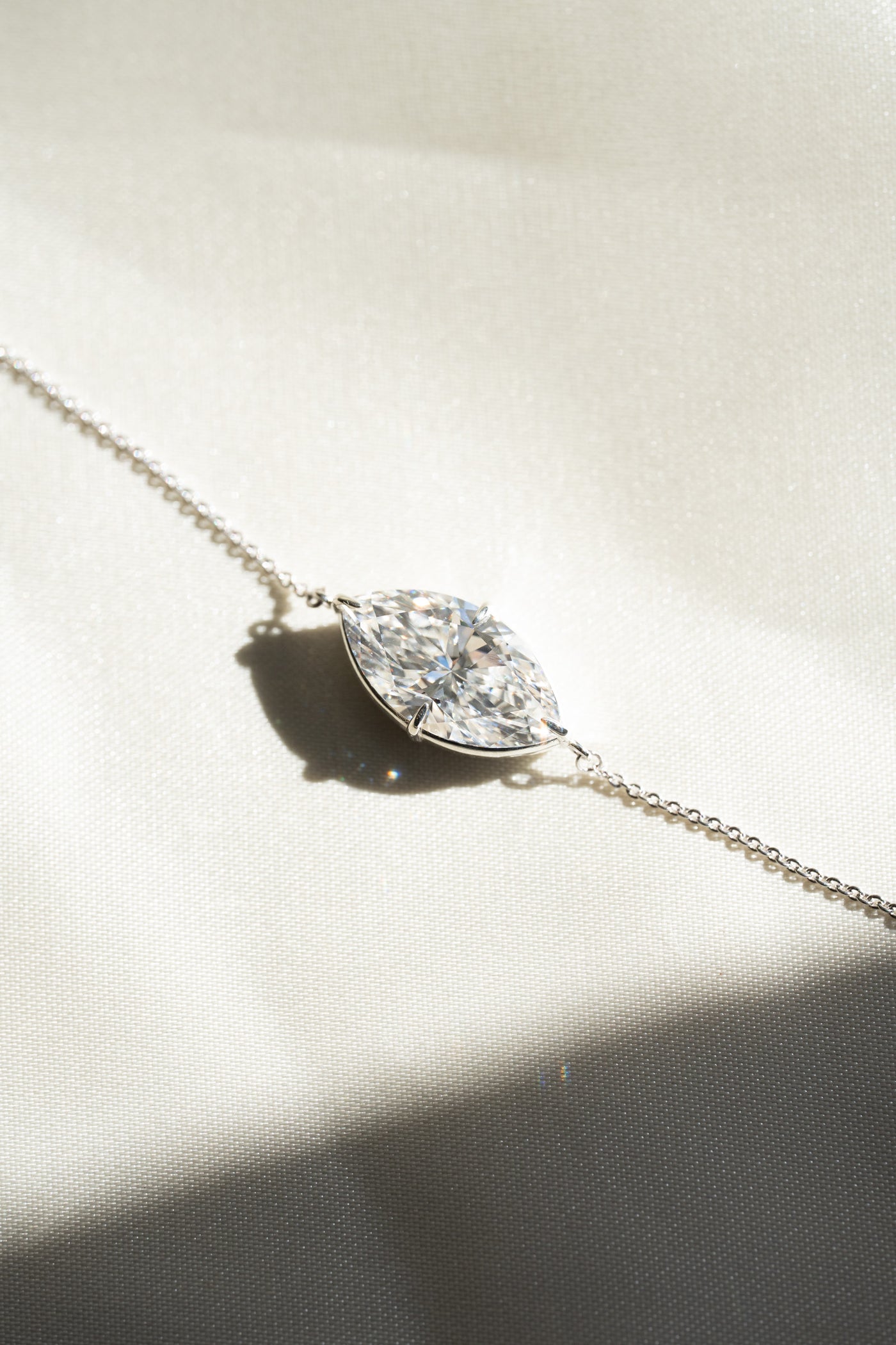 Selene, a five carat marquise lab-grown diamond pendant worn east to west, from the Evermore collection