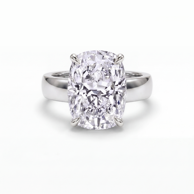The Maeve cushion solitaire engagement ring in 18ct white gold and platinum, a 6.00 carat cushion cut lab-grown diamond on a wide 5mm band